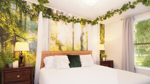 A bedroom with a bed, two nightstands, a window, and a forest-themed wall. - Relaxing Cottage Near Fishhawk (Lithia)