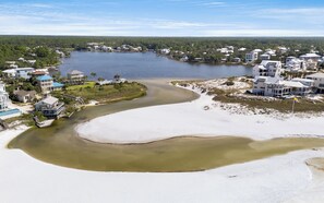 A coastal area with a sandy beach, a river, and residential buildings. - Eastern Lake Home + Dock - Walk to Beach + Bikes (Santa Rosa Beach)