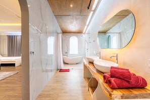 Combined shower/bathtub, hair dryer, towels, soap