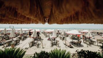 Private beach, white sand, beach umbrellas, beach towels