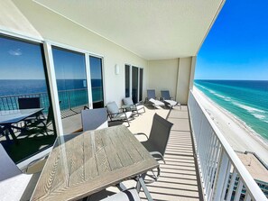 Outdoor dining - Beach-Front Condo, Comfortable Recliners, XL Balcony, Free Beach Chairs! (Panama City Beach)