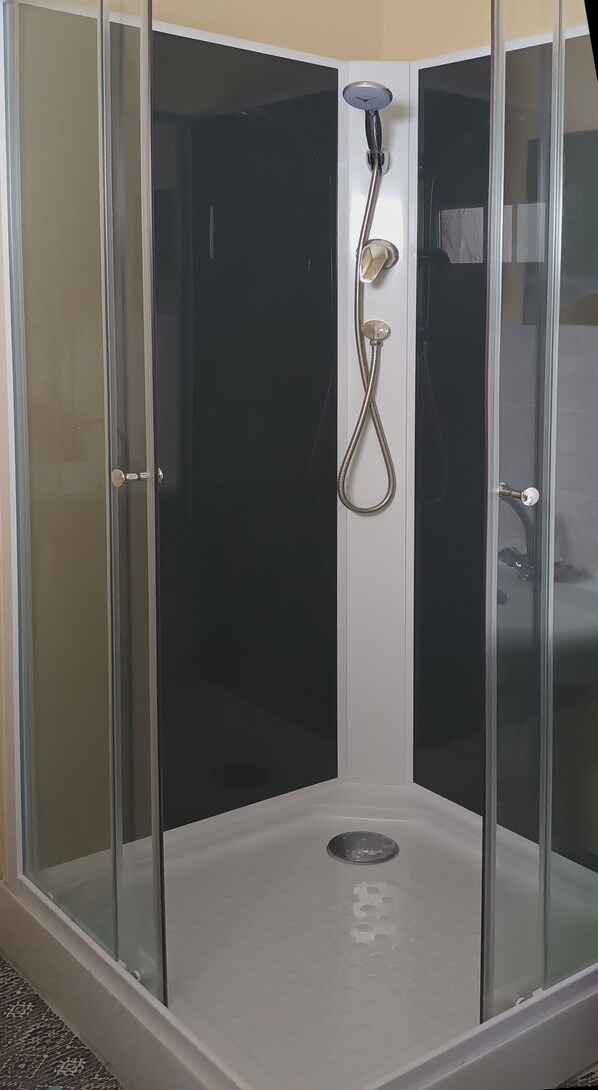 Shower, hair dryer, towels, soap