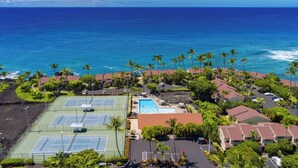 A coastal resort with tennis courts, a swimming pool, and ocean views. - KKSR#8101 GORGEOUS 2 BEDR, GROUND FLOOR CORNER, REMODELED, AIR CONDITIONING (Kailua Kona)