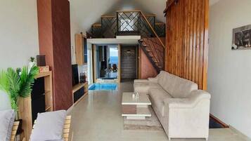 Villa (Triplex One Bedroom villa with swimmi) | Living room | TV
