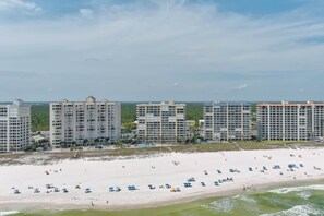 A beach with multiple high-rise buildings in the background.