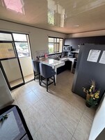 Deluxe Apartment, 2 Bedrooms, Kitchen | Private kitchen | Full-size fridge, microwave, oven, stovetop