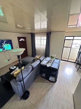 Deluxe Apartment, 2 Bedrooms, Kitchen | Living area | 55-inch Smart TV with cable channels, TV