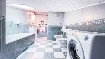 Bathtub, hair dryer, towels