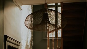 A wooden staircase with a textured wall and patterned floor. - Villa Marguerite (Saint-Omer)