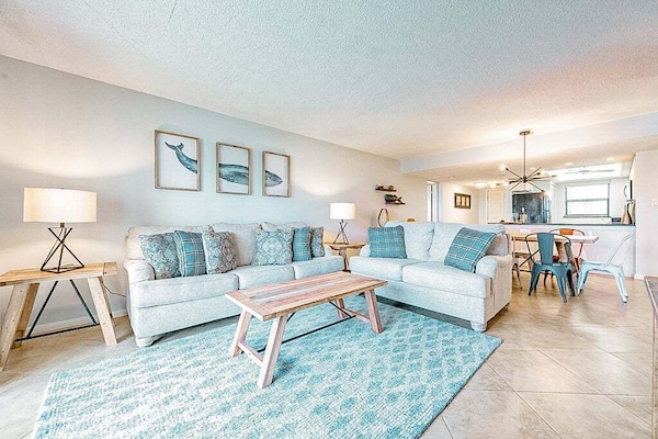 Stylish living area with coastal charm and open, airy vibes.