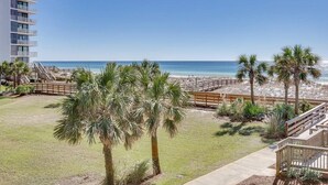 A beachfront property with a wooden boardwalk, palm trees, and a view of the ocean. - ⭐Walk 2 Beach-Gulf + Pool Views-2 Pools + Hot Tub-2BR Mainsail 213⭐ (Miramar Beach)