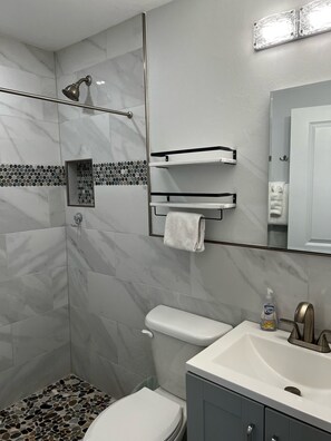 Shower, hair dryer, towels, soap