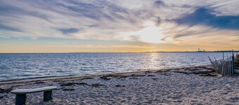 Oceanfront cottage near town with full kitchen, AC, beach access & patio