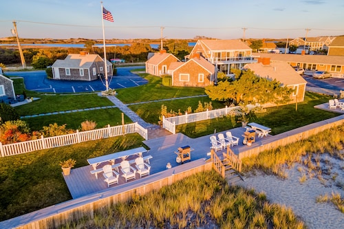 Oceanfront cottage near town with full kitchen, AC, beach access & patio