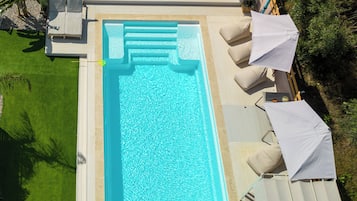 Seasonal outdoor pool, a heated pool, pool umbrellas, sun loungers