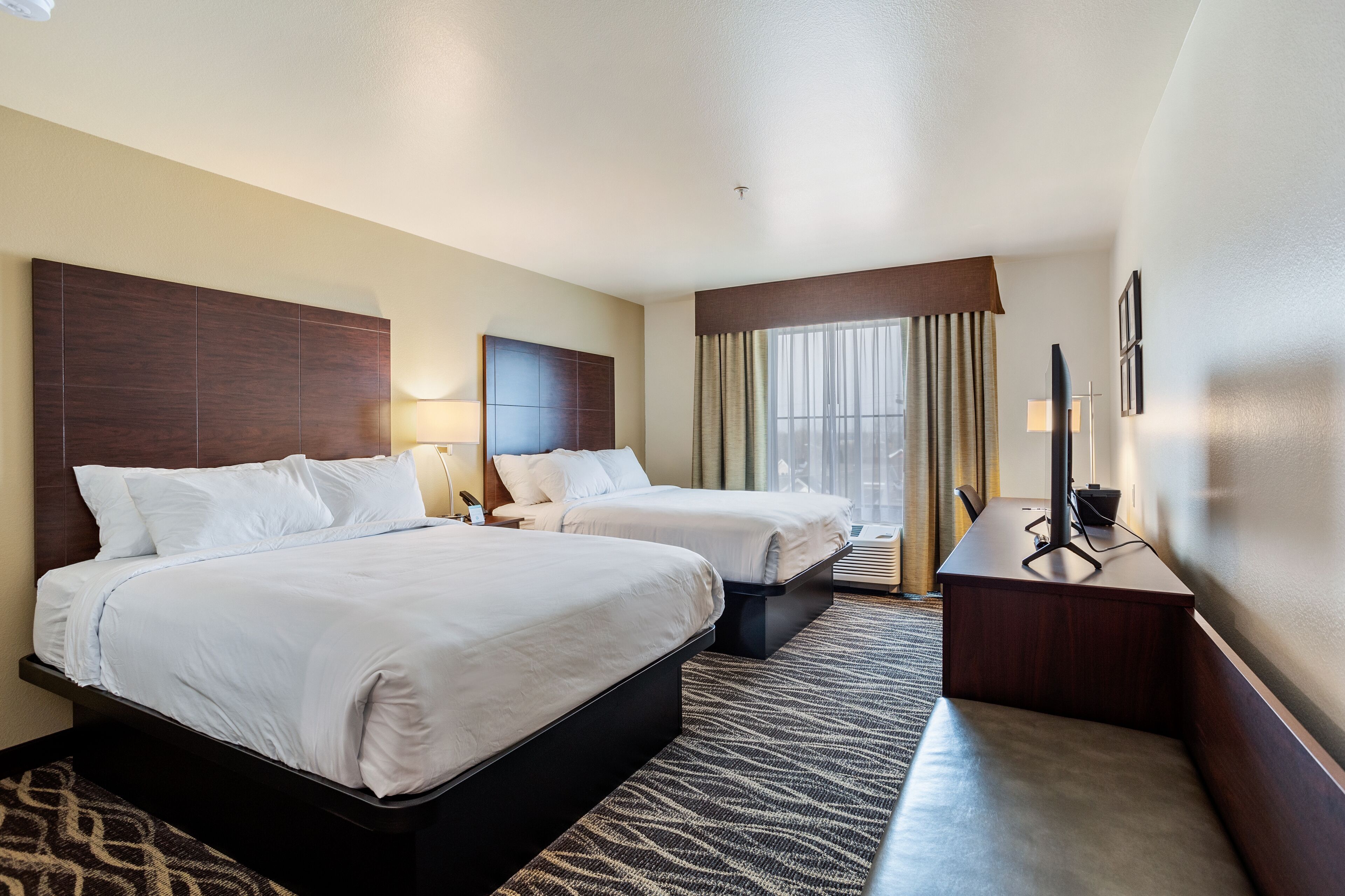 Premium bedding, pillowtop beds, desk, laptop workspace