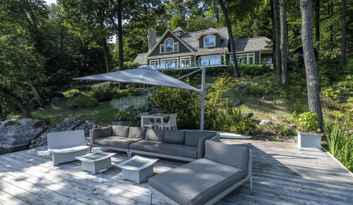 Exquisite 5 Bdrm 4 Bath Cottage with Boathouse and Professional Gym! SW Views!