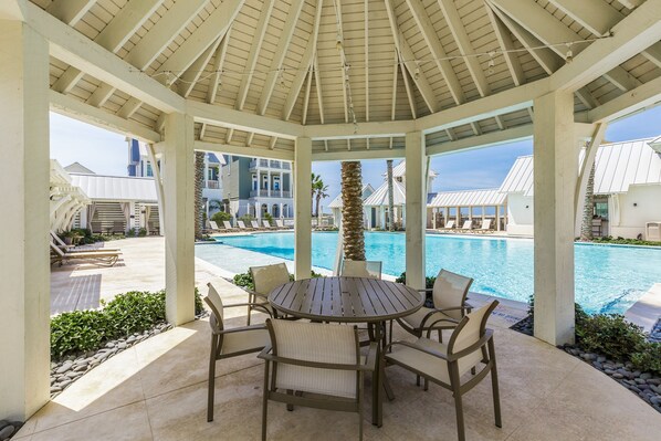 Relax by the pool with a view of the surrounding landscape.