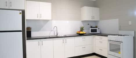 Apartment, 2 Bedrooms | Private kitchen | Full-size fridge, microwave, oven, stovetop