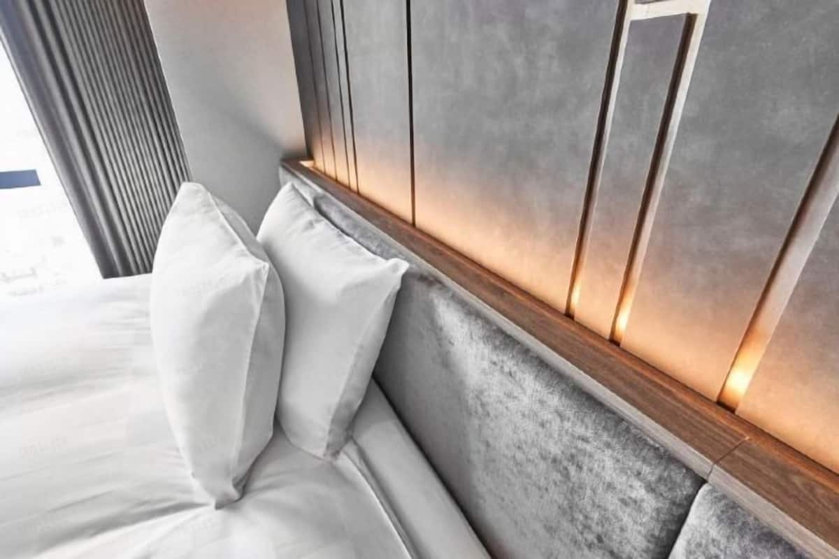 Premium bedding, down comforters, memory foam beds, in-room safe
