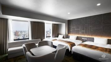 A hotel room with two beds, a sofa, a table, and a view of the city.