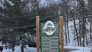 A sign listing various destinations in La Forêt. - Best ski-in/ ski-out with A/C and fireplace! (Mont-Tremblant)