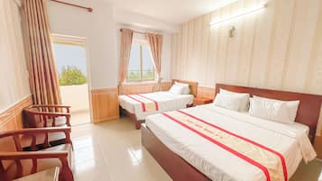 Deluxe Triple Room, Beach View | Premium bedding, memory foam beds, desk, blackout drapes