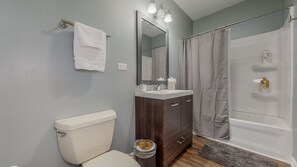 Combined shower/tub, hair dryer, towels, soap