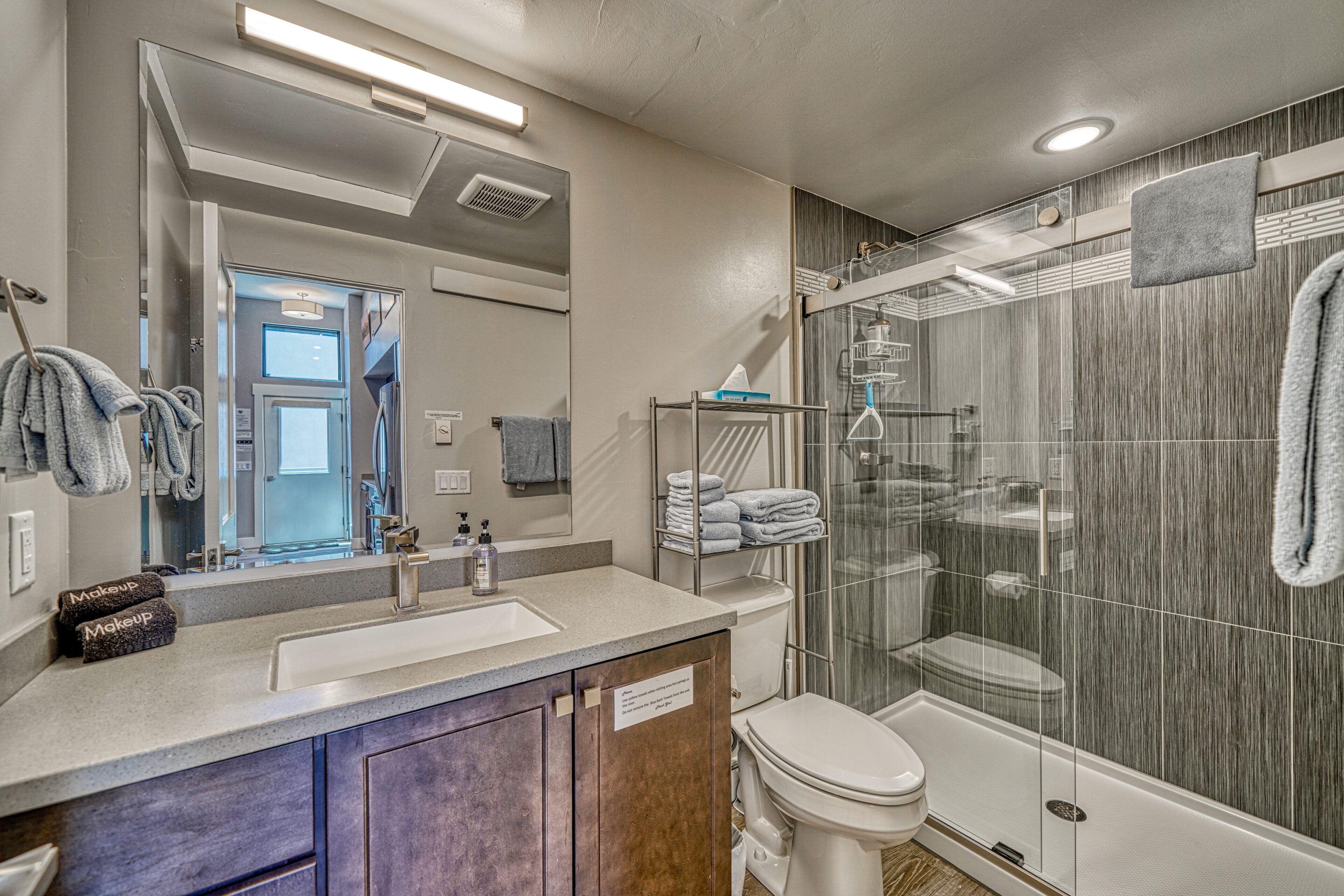 Shower, hair dryer, towels, toilet paper