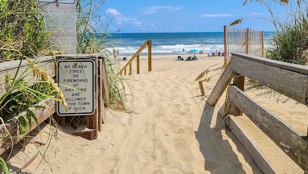 A beach path leading to the ocean with a sign prohibiting beach fires or fireworks. - The Last Resort ⛱️High on a dune with spectacular views - 4 BR/2 BA oceanside home in Duck⛱️ (Duck)