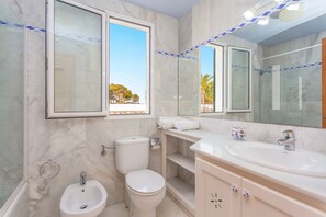 Bathtub, hair dryer, towels