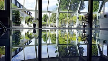 Indoor pool, open 6:00 AM to 10:00 PM, pool loungers