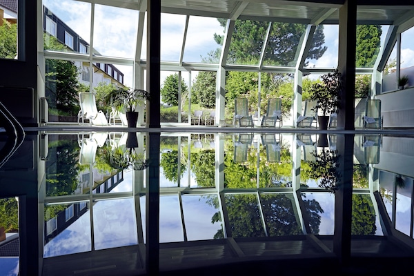 Indoor pool, open 6:00 AM to 10:00 PM, sun loungers