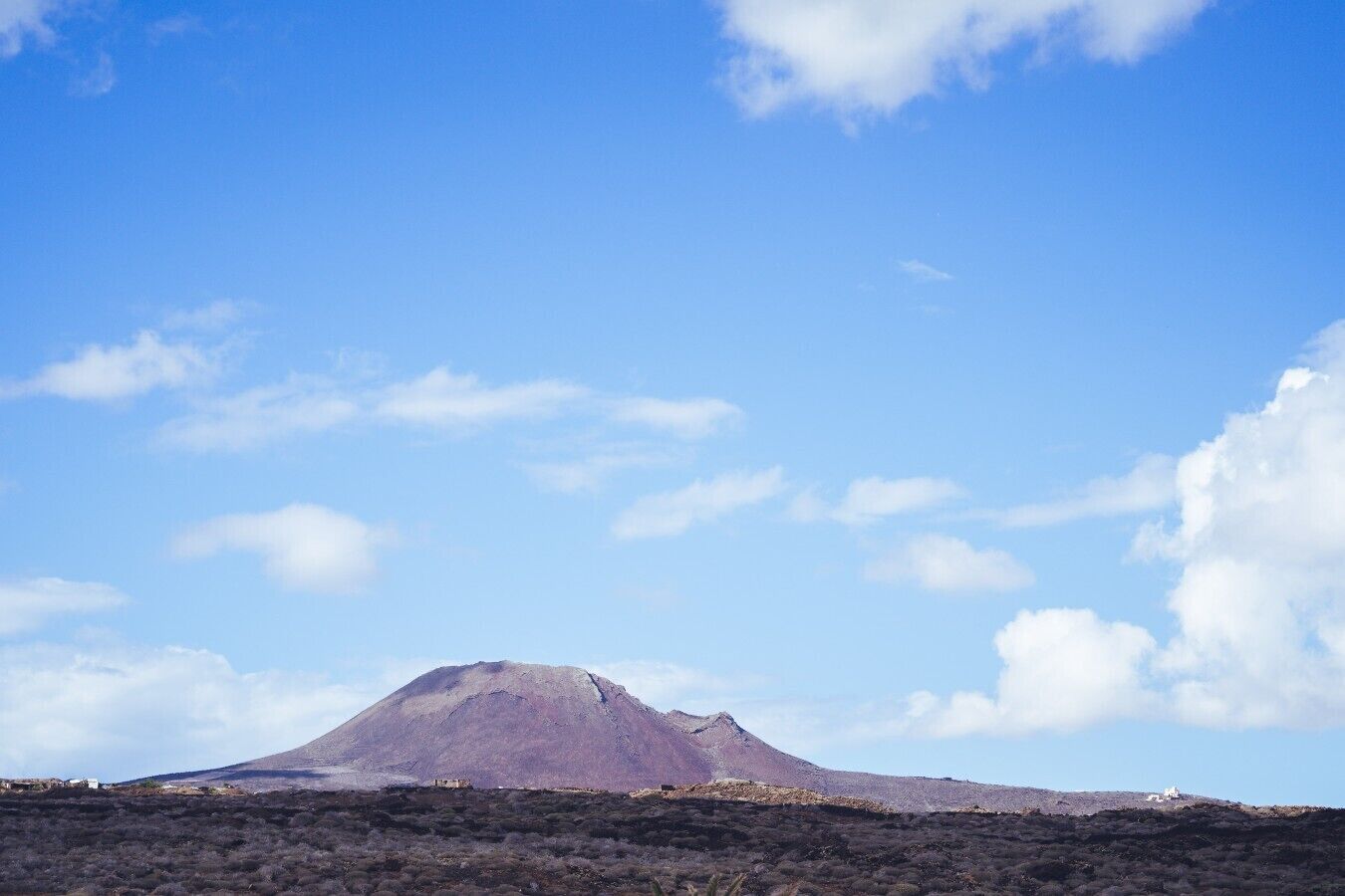 A mountain landscape with a clear sky.