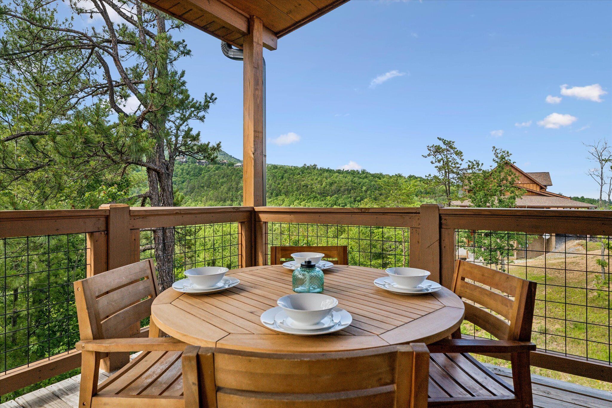 Enjoy a meal on the patio while soaking up the mountain views of the Smokies | Elkridge Cabin in Sevierville, TN | Cabins with Hot Tubs | Luxury Cabin Rentals