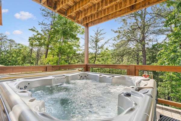Unwind in the hot tub after a long day of hiking in the national park | Elkridge Cabin in Sevierville, TN | Great Smoky Mountains Cabin Rentals | Smoky Mountain Rentals | Cabins with Hot Tubs