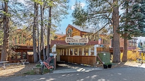 A rustic store named 'General Store' with a wooden facade, located in a wooded area. - Year Round Condo- Sleeps 5! - Tamarack #17 by Bear Valley Vacation Rentals (Arnold)