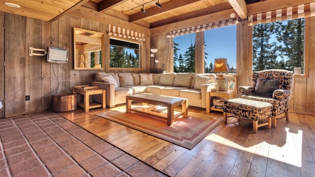 A cozy wooden interior with a sofa, armchair, and coffee table. - Overlooking Beautiful Bear Lake VH#318 by Bear Valley Vacation Rentals (Arnold)