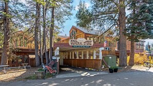 A rustic store named 'General Store' with a wooden facade, located in a wooded area. - Modern & Sleek Condo - Creekside #110 by Bear Valley Vacation Rentals (Arnold)
