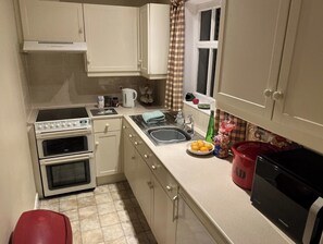 Enjoy cooking in this well-equipped kitchen with an oven, stovetop, and sink.