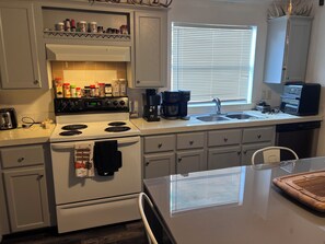 Fridge, microwave, oven, stovetop - Moody’s Fish Camp Short Term Rental (Marble Falls)