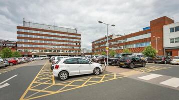 A parking lot with multiple cars and a building labeled "York Hospital Main Entrance" in the background.