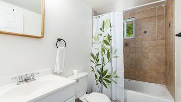 Bathtub, hair dryer, towels