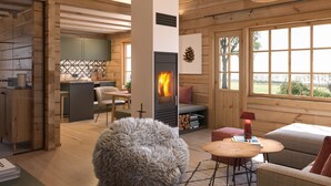 A cozy cabin interior with a wooden interior, a fireplace, a dining area, and a large window offering a view of the outdoors. - Bunter Bock  Die Harz-Urlaubs-Alm (Clausthal-Zellerfeld)