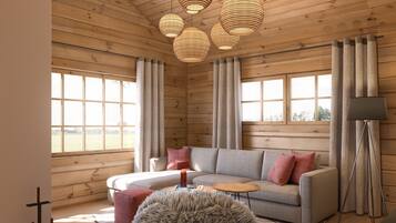 Comfort-Haus, 1 King-Bett, Sauna, Talblick | Wohnbereich | Flachbildfernseher