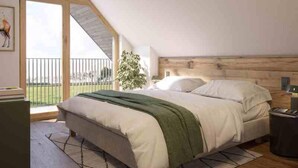 A bedroom with a sloped ceiling, a bed with a green throw, a nightstand, and a view of the outdoors. - Bunter Bock  Die Harz-Urlaubs-Alm (Clausthal-Zellerfeld)