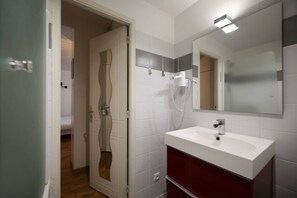 Bathtub, hair dryer, towels