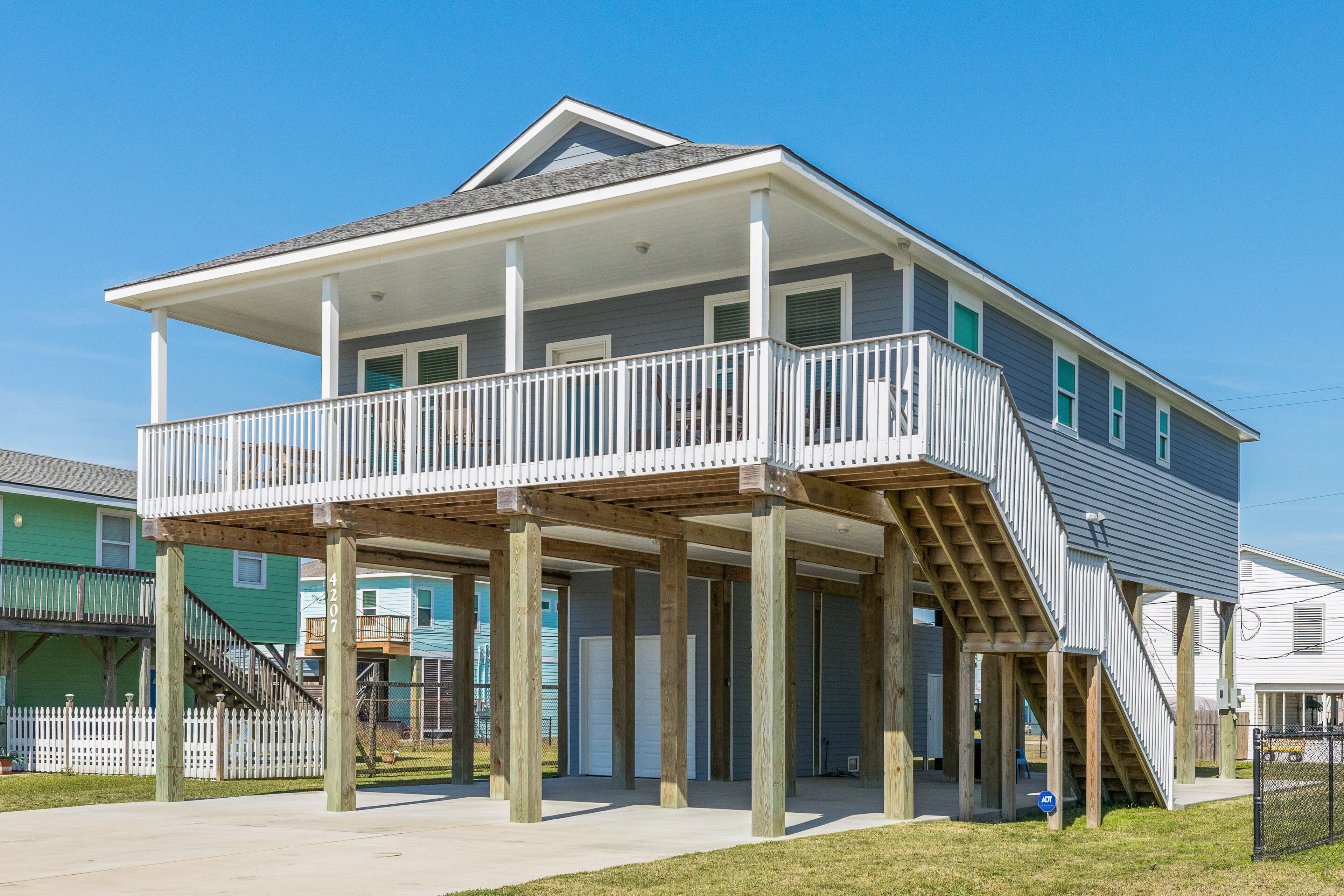 Elevated coastal home with deck, patio, outdoor shower, & fireplace - dogs ok