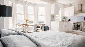 1 bedroom, desk, iron/ironing board, travel crib