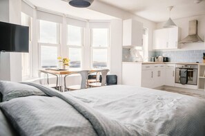 1 bedroom, desk, iron/ironing board, travel cot